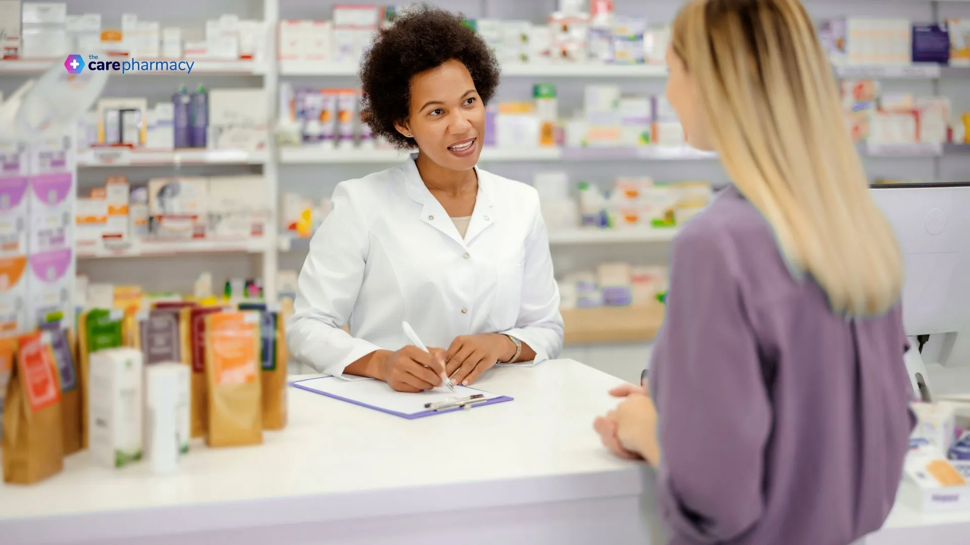 Pharmacists and patient at the counter